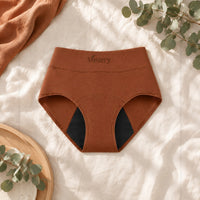 Culotte absorbante Vostery terracotta taille haute avec fond absorbant noir, posée à plat