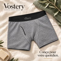 Boxer anti-fuites homme Vostery gris avec ceinture noire et ouverture braguette, posé sur du lin